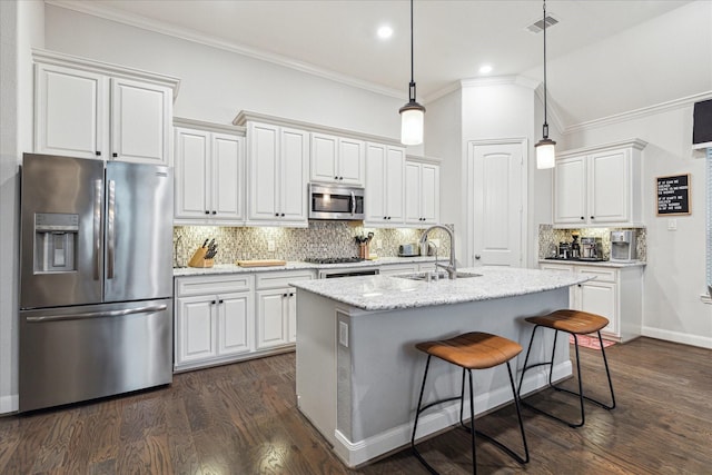 kitchen featuring backsplash, appliances with stainless steel finishes, ornamental molding, and a sink