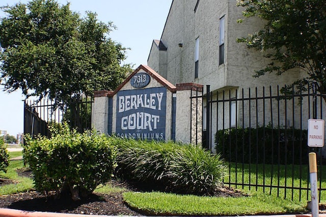 community sign with fence