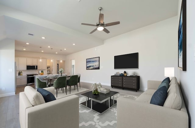 19714 Palomino Prairie Trl, Tomball, TX 77377 - living area with baseboards, recessed lighting, light wood-style flooring, and ceiling fan