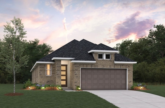 19714 Palomino Prairie Trl, Tomball, TX 77377 - view of front facade with a front yard, brick siding, a garage, and driveway