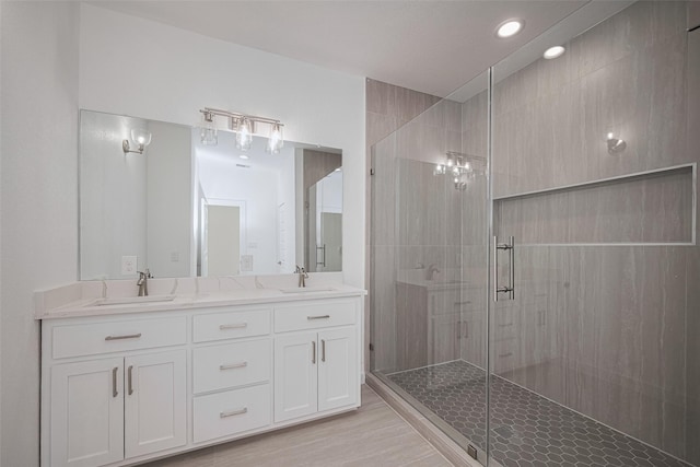 7307 W Knoll St, Houston, TX 77028 - full bathroom with a shower stall, recessed lighting, double vanity, and a sink