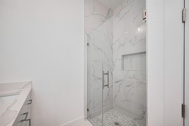 7307 W Knoll St, Houston, TX 77028 - bathroom featuring a marble finish shower and vanity