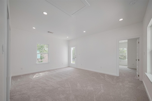 7307 W Knoll St, Houston, TX 77028 - empty room with attic access, light carpet, and recessed lighting