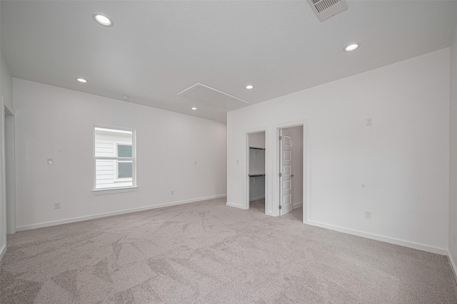 7307 W Knoll St, Houston, TX 77028 - unfurnished bedroom featuring recessed lighting, attic access, baseboards, visible vents, and light carpet