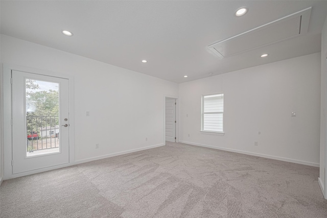 7307 W Knoll St, Houston, TX 77028 - carpeted spare room featuring attic access, baseboards, and recessed lighting