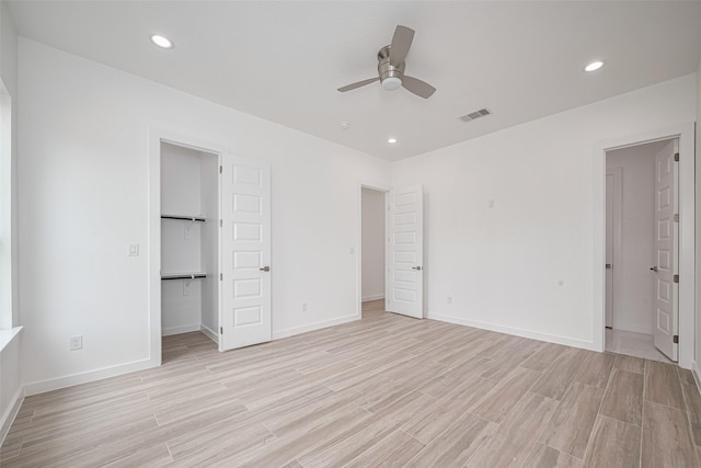 7307 W Knoll St, Houston, TX 77028 - unfurnished bedroom with visible vents, recessed lighting, light wood-style flooring, a spacious closet, and baseboards