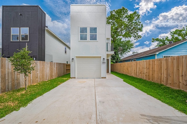 7307 W Knoll St, Houston, TX 77028 - exterior space featuring concrete driveway, an attached garage, stucco siding, and fence