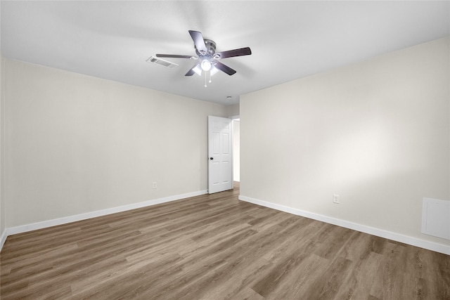 6727 Winding Trace Dr, Houston, TX 77086 - empty room featuring wood finished floors, ceiling fan, and baseboards