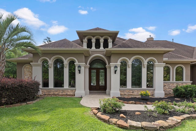 8483 Majestic Lake Ct, Montgomery, TX 77316 - back of house with a yard, french doors, stucco siding, a shingled roof, and stone siding