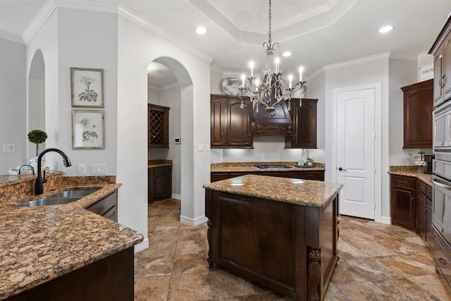 8483 Majestic Lake Ct, Montgomery, TX 77316 - kitchen featuring stone tile flooring, arched walkways, and a sink