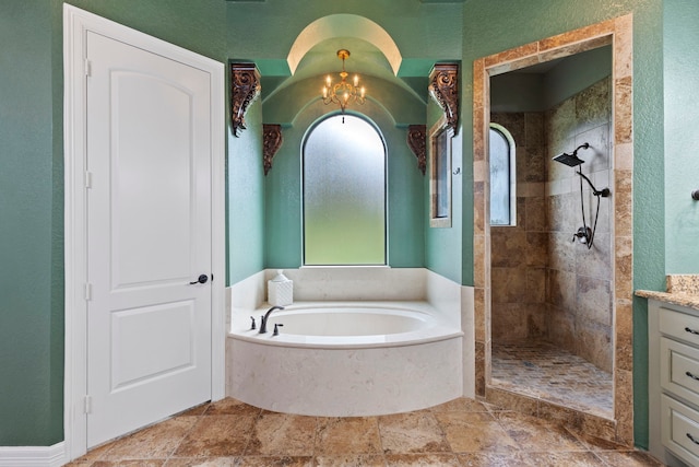8483 Majestic Lake Ct, Montgomery, TX 77316 - full bath with an inviting chandelier, a bath, a tile shower, vanity, and a textured wall