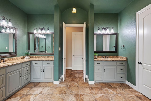 8483 Majestic Lake Ct, Montgomery, TX 77316 - bathroom with baseboards, vanity, and a textured wall