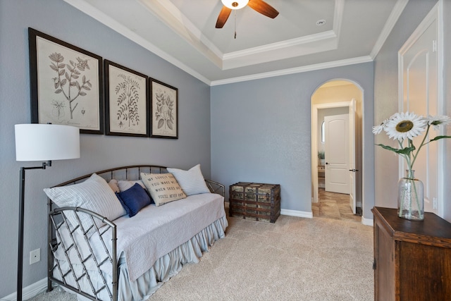 8483 Majestic Lake Ct, Montgomery, TX 77316 - carpeted bedroom featuring crown molding, ceiling fan, arched walkways, a tray ceiling, and baseboards