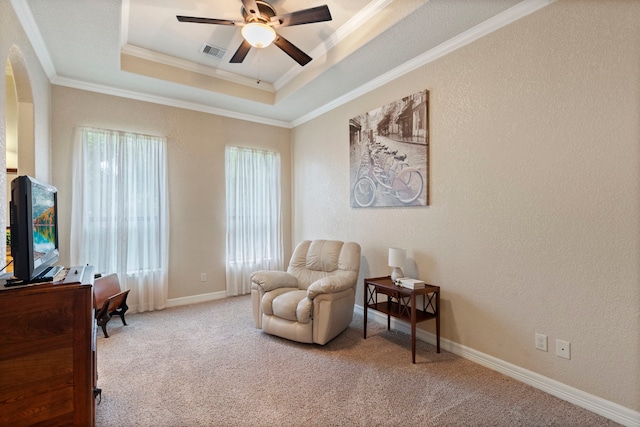 8483 Majestic Lake Ct, Montgomery, TX 77316 - living area with a tray ceiling, ornamental molding, ceiling fan, visible vents, and carpet floors
