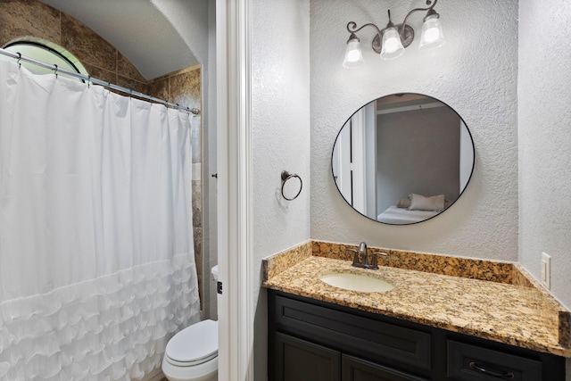 8483 Majestic Lake Ct, Montgomery, TX 77316 - bathroom featuring toilet, a shower with shower curtain, a textured wall, vanity, and lofted ceiling