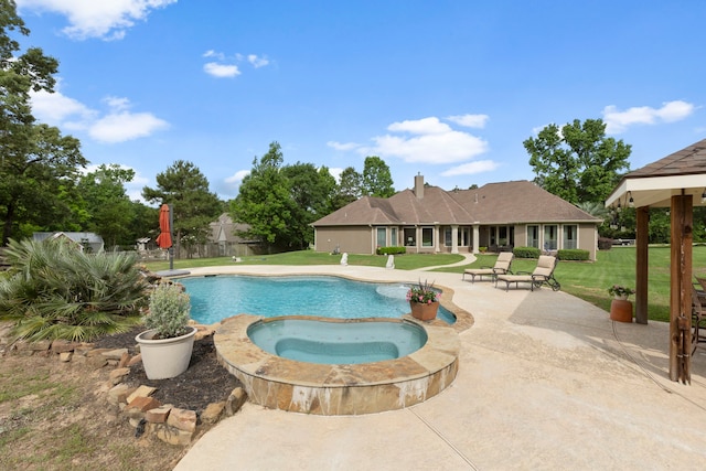 8483 Majestic Lake Ct, Montgomery, TX 77316 - view of pool with a patio area, a pool with connected hot tub, and a lawn