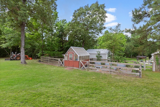 8483 Majestic Lake Ct, Montgomery, TX 77316 - view of yard featuring fence, a greenhouse, and an outdoor structure