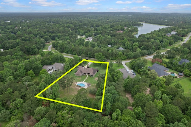 8483 Majestic Lake Ct, Montgomery, TX 77316 - drone / aerial view with a wooded view and a water view