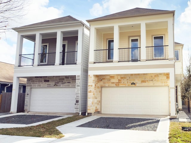 1111 Robbie St, Houston, TX 77009 - view of front of property with a balcony, stone siding, and a garage