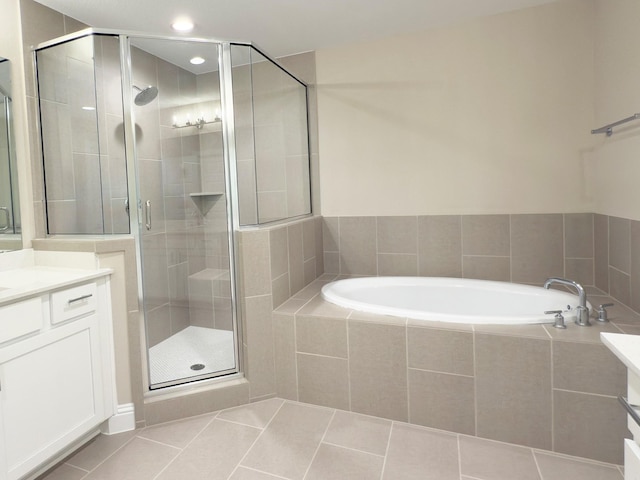 1111 Robbie St, Houston, TX 77009 - bathroom featuring vanity, a bath, a shower stall, tile patterned floors, and recessed lighting