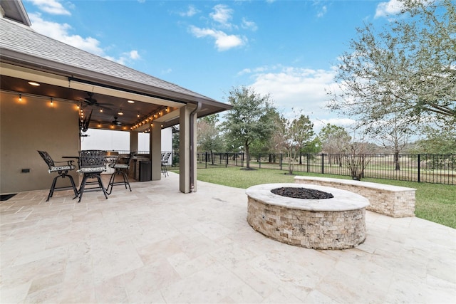 18538 Wade Creek Ln, Cypress, TX 77433 - view of patio with a fenced backyard, an outdoor fire pit, outdoor dining area, and ceiling fan