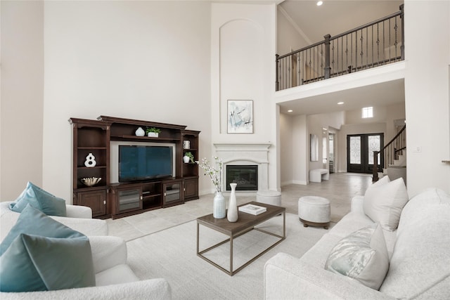 18538 Wade Creek Ln, Cypress, TX 77433 - living room with a premium fireplace, recessed lighting, tile patterned floors, a towering ceiling, and stairway