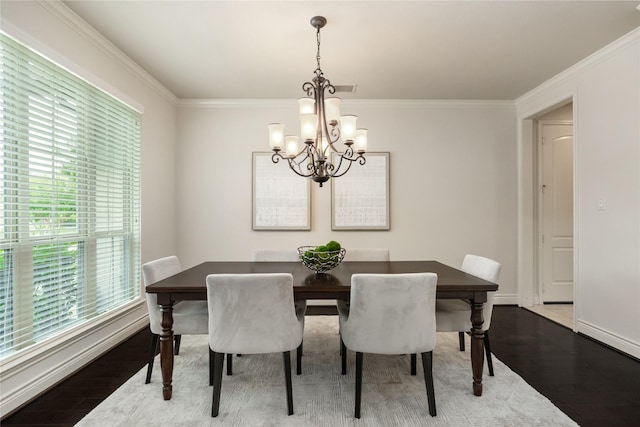 18538 Wade Creek Ln, Cypress, TX 77433 - dining room with an inviting chandelier, crown molding, baseboards, and wood finished floors