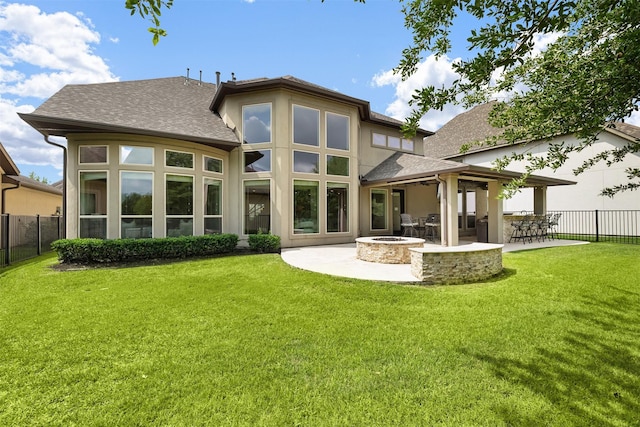 18538 Wade Creek Ln, Cypress, TX 77433 - back of house with an outdoor fire pit, a patio, fence, and a lawn