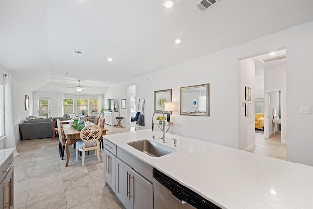18740 Laurel Hills Dr, New Caney, TX 77357 - kitchen with ceiling fan, visible vents, open floor plan, and a sink
