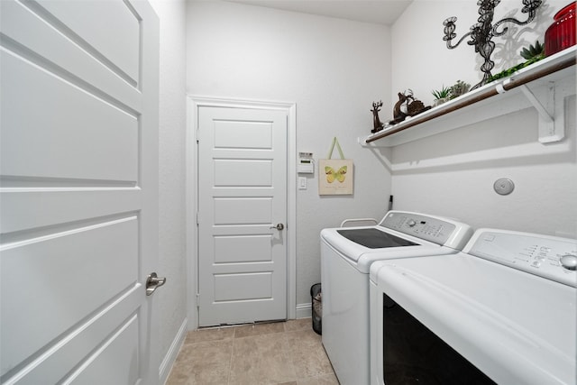 18740 Laurel Hills Dr, New Caney, TX 77357 - clothes washing area featuring separate washer and dryer, laundry area, baseboards, and light tile patterned flooring
