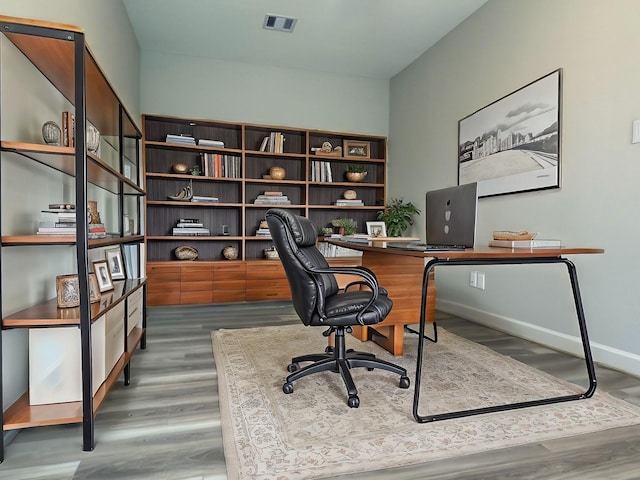 313 E 27th St, Houston, TX 77008 - office space featuring visible vents, wood finished floors, and baseboards