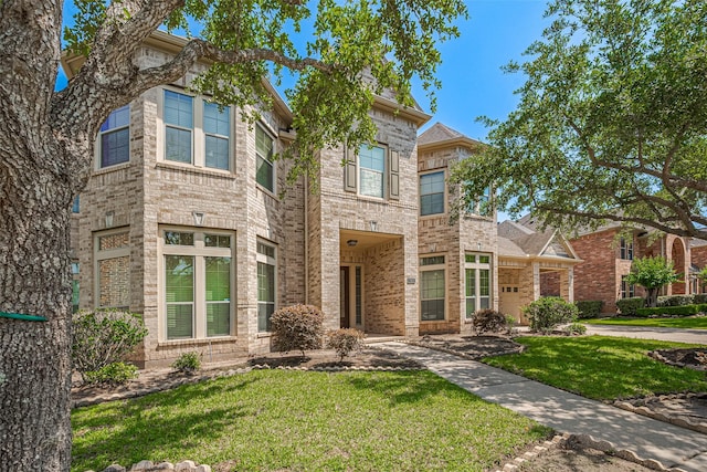 7611 Herndon Pl, Sugar Land, TX 77479 - view of front of property with a front lawn