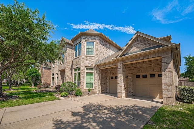 7611 Herndon Pl, Sugar Land, TX 77479 - view of front of home with concrete driveway, a garage, brick siding, and a front lawn