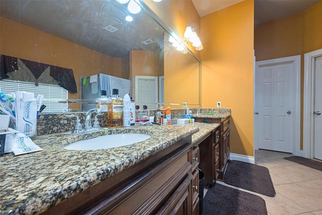 7611 Herndon Pl, Sugar Land, TX 77479 - bathroom featuring tile patterned floors, vanity, and baseboards
