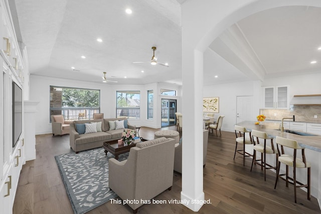 686 Edgewood Dr, Montgomery, TX 77356 - living room featuring crown molding, arched walkways, a ceiling fan, and recessed lighting