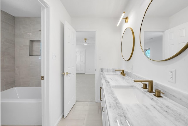 686 Edgewood Dr, Montgomery, TX 77356 - full bathroom with a sink, tile patterned floors, a ceiling fan, double vanity, and baseboards