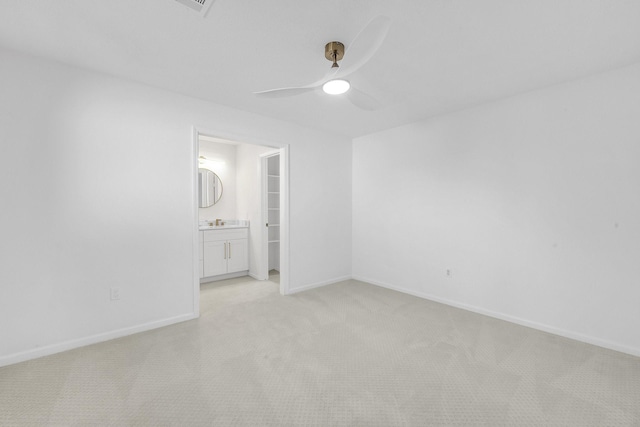 686 Edgewood Dr, Montgomery, TX 77356 - unfurnished bedroom with light colored carpet, ensuite bathroom, baseboards, and ceiling fan