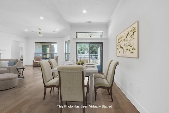 686 Edgewood Dr, Montgomery, TX 77356 - dining room featuring crown molding, wood finished floors, baseboards, and recessed lighting
