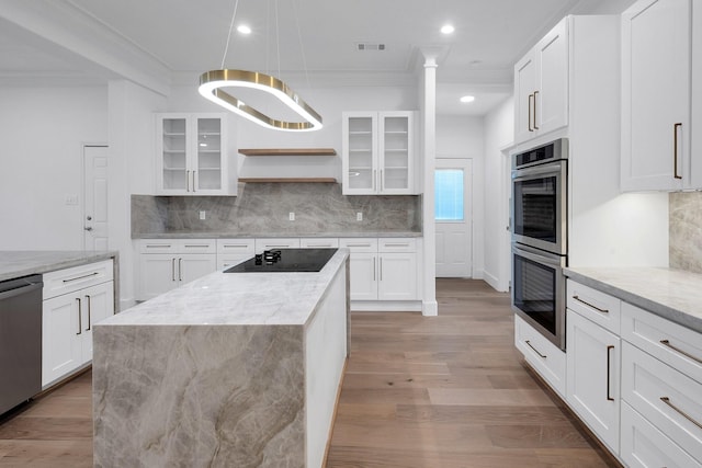 686 Edgewood Dr, Montgomery, TX 77356 - kitchen featuring ornamental molding, stainless steel appliances, decorative backsplash, and light wood-style flooring