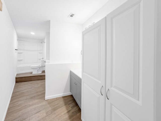 686 Edgewood Dr, Montgomery, TX 77356 - bathroom with toilet, wood finished floors, baseboards, vanity, and recessed lighting