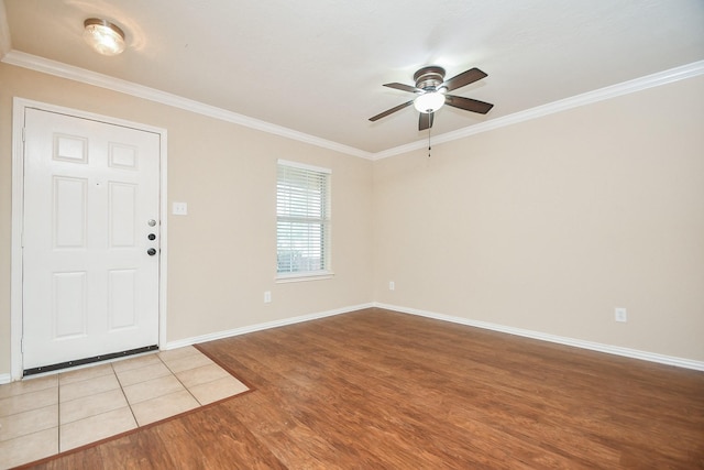 19826 Seagler Glen Ln, Katy, TX 77449 - entryway with wood finished floors, a ceiling fan, crown molding, and baseboards