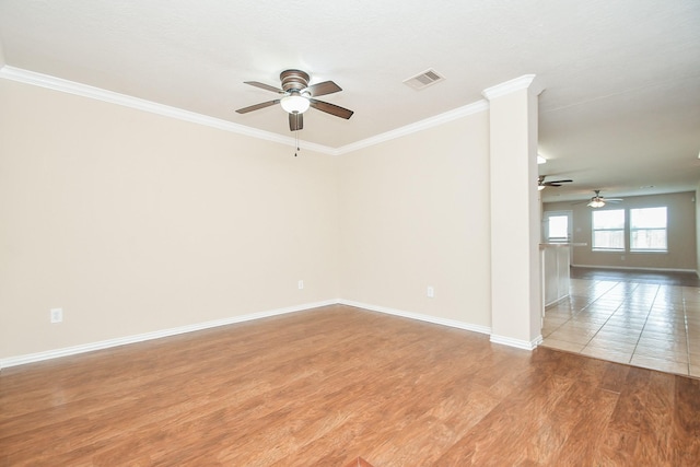 19826 Seagler Glen Ln, Katy, TX 77449 - empty room featuring ceiling fan, light wood-type flooring, ornamental molding, and baseboards