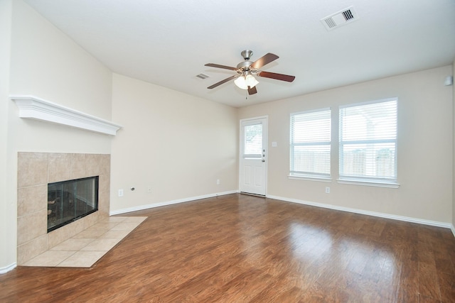 19826 Seagler Glen Ln, Katy, TX 77449 - unfurnished living room with ceiling fan, wood finished floors, a fireplace, and baseboards