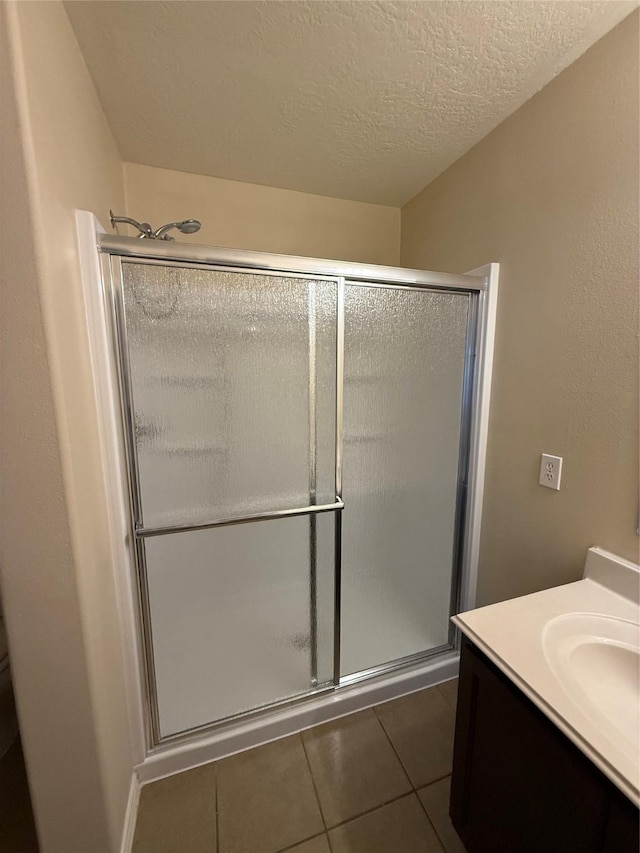 19826 Seagler Glen Ln, Katy, TX 77449 - full bathroom featuring tile patterned flooring, a stall shower, and vanity