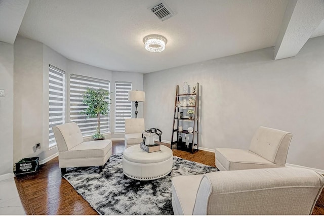 16107 Lakestone Dr, Tomball, TX 77377 - sitting room with wood finished floors, baseboards, and a textured ceiling