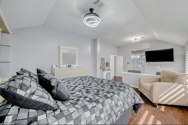 16107 Lakestone Dr, Tomball, TX 77377 - bedroom with lofted ceiling and wood finished floors