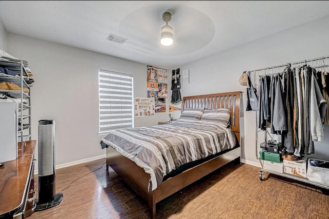 16107 Lakestone Dr, Tomball, TX 77377 - bedroom with wood finished floors, baseboards, and ceiling fan