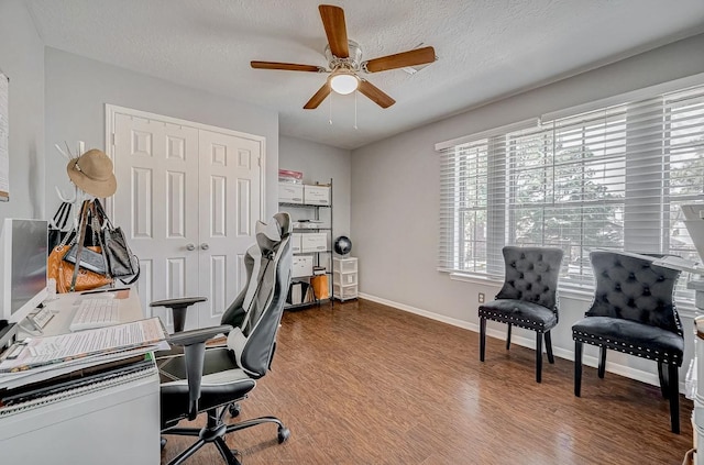 16107 Lakestone Dr, Tomball, TX 77377 - office space featuring healthy amount of natural light, a ceiling fan, wood finished floors, baseboards, and a textured ceiling
