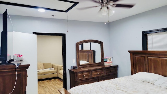 bedroom with light wood-style flooring and ceiling fan