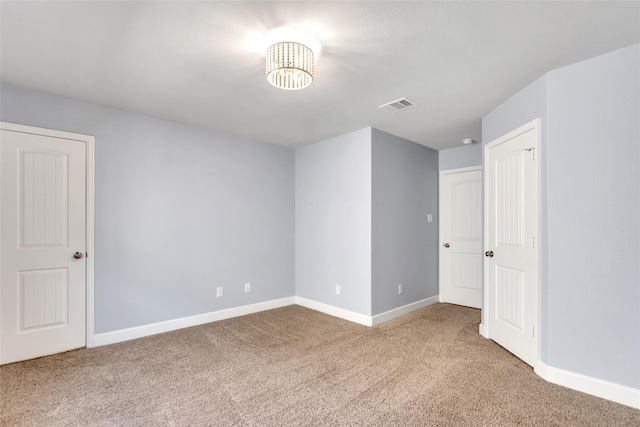 5432 Nolda St, Houston, TX 77007 - carpeted empty room with baseboards, a chandelier, and visible vents